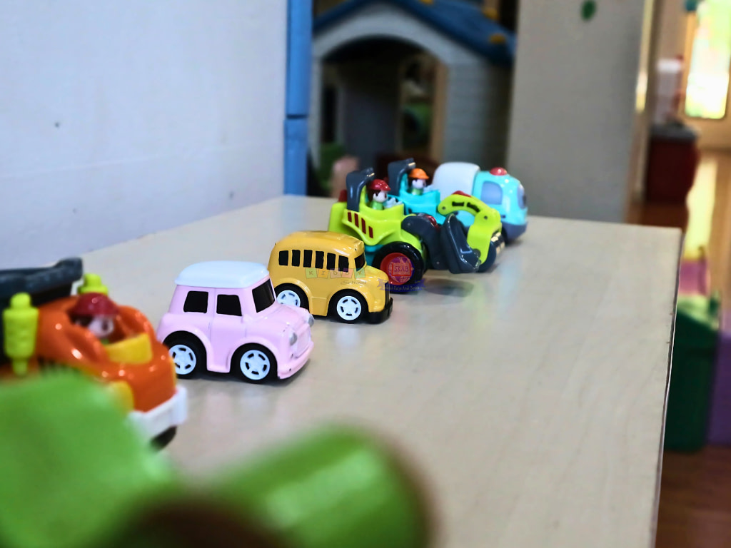 Lined up toys on a table for children to play in Kiddy School.